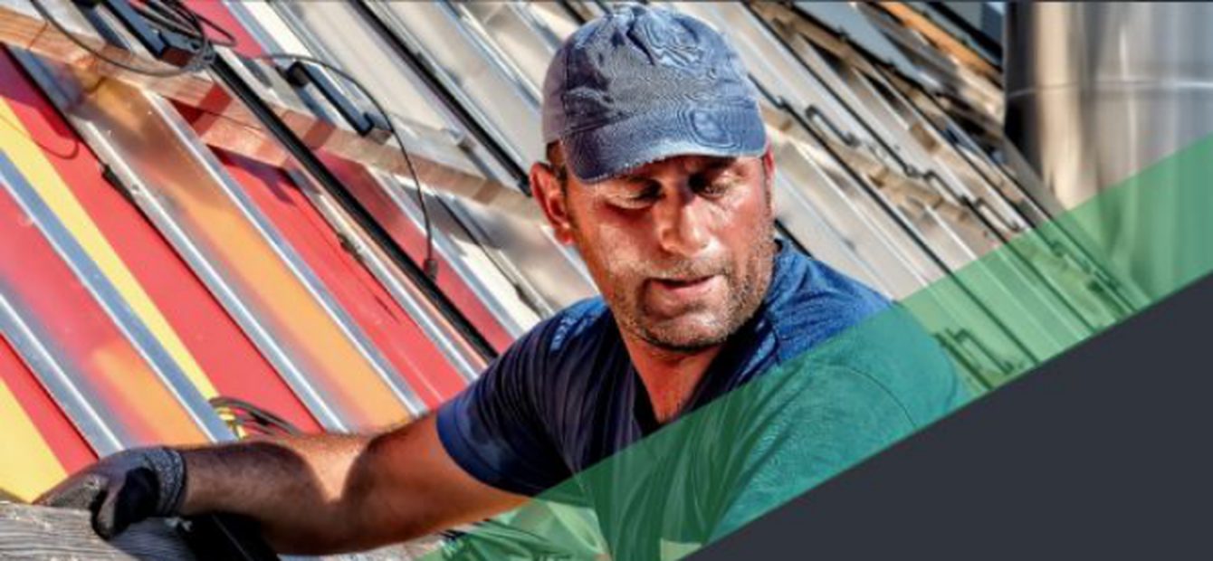Solar installer working on a roof